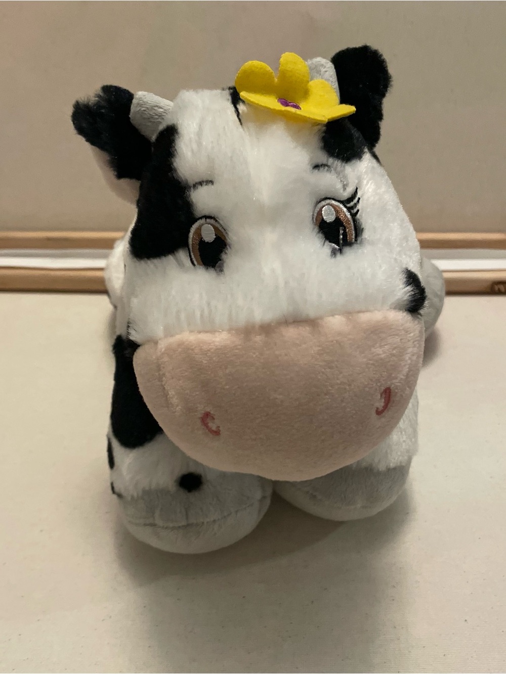 Plush Black & White Cow Stuffed Animal with Yellow Flower and heart on hoof